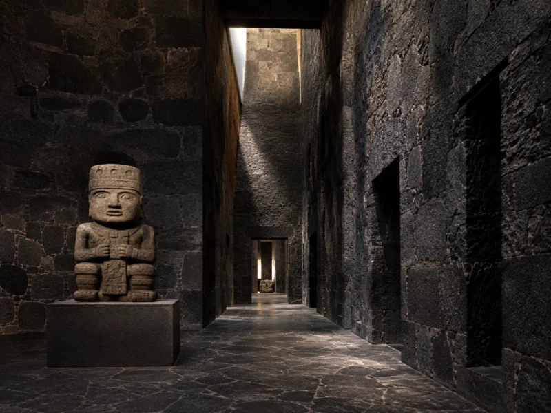 Dark volcanic-stone gallery with a pre-Hispanic sculpture at Museo Anahuacalli