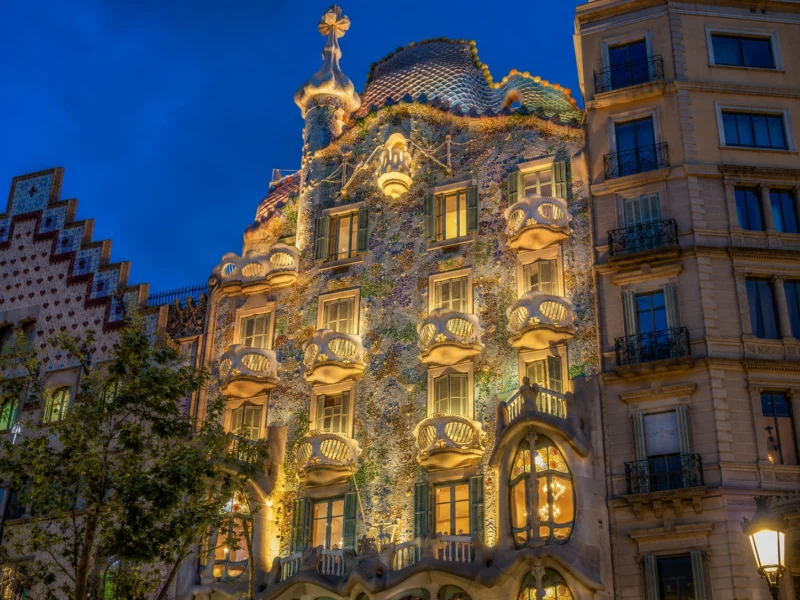 At blue hour, Casa Batlló becomes almost theatrical, its sculpted balconies, mosaic skin, and illuminated interiors revealing the expressive power of Catalan Modernisme. Casa Batlló at blue hour. AI Image by ChatGPT